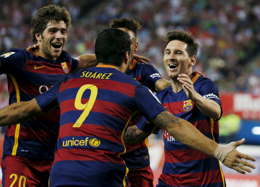 Messi lifts Barca, five for record-breaker Ronaldo