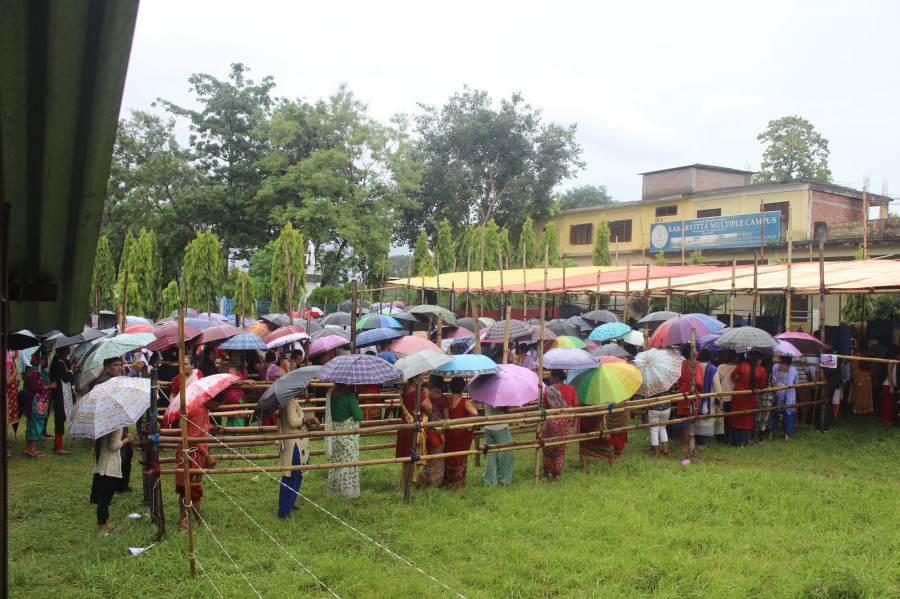 Voters queue up to vote despite rain in Jhapa (Photo feature)