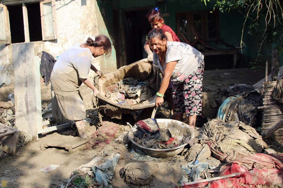 Cleaning the mess after the floods (Photo feature)