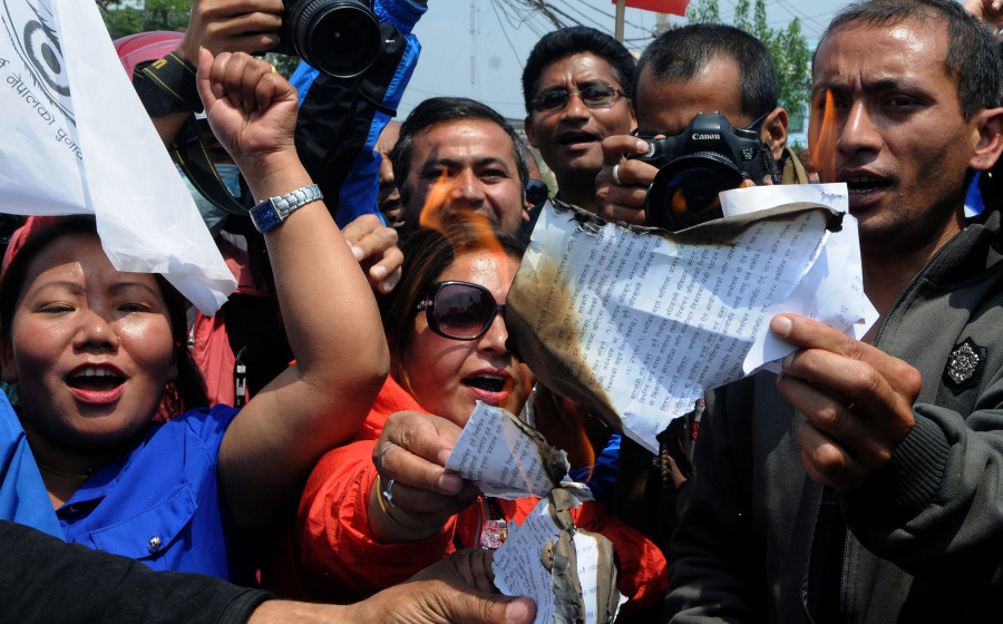 Naya Shakti cadres torch copies of election code (In photos)