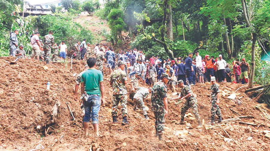 Nine killed as landslide buries houses