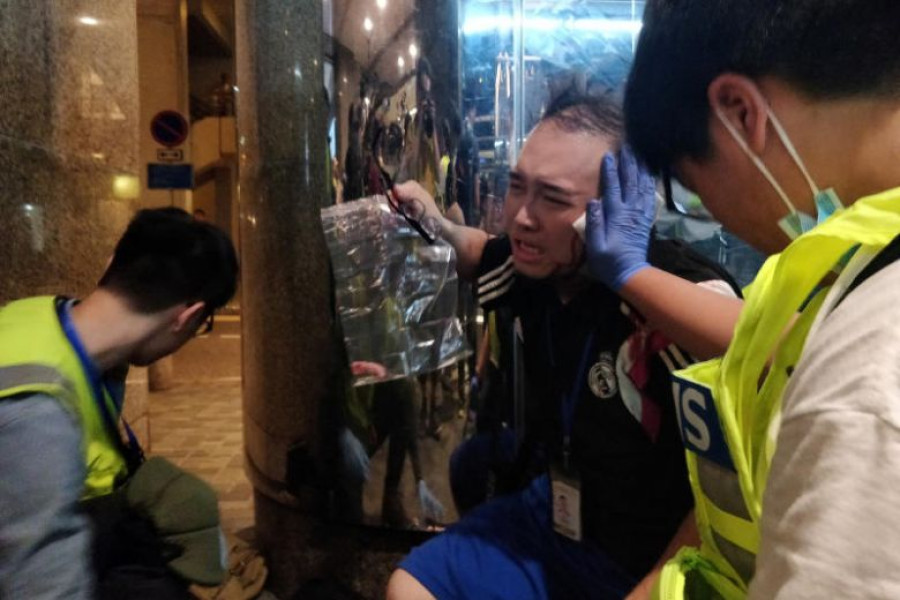 Six wounded as knife attack caps day of Hong Kong political chaos 