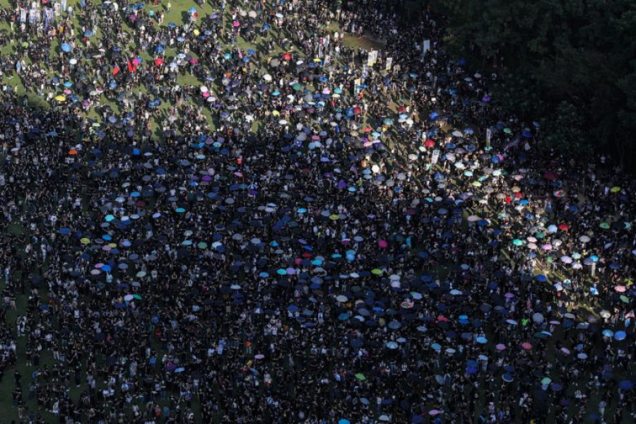 Clashes in Hong Kong after thousands gather for banned rally; Xinhua News Agency office vandalised