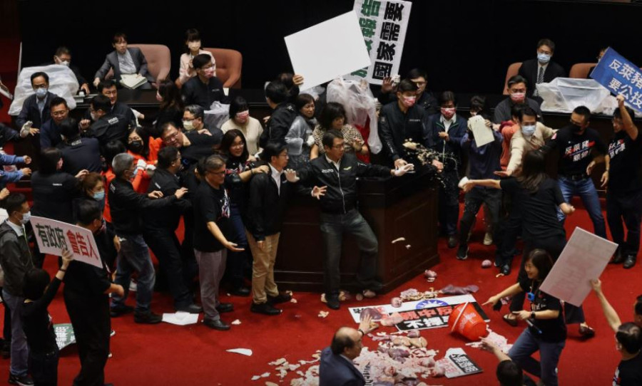 Fists and pig guts fly in Taiwan parliament debate on US pork