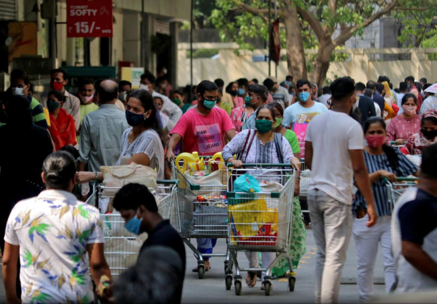 India reports more than 200,000 new Covid-19 cases for first time