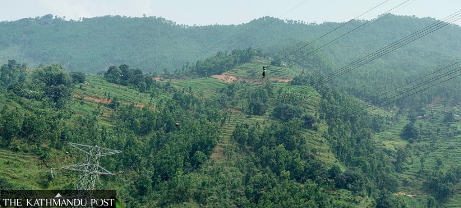 Power utility forced to cut power for industries after a man climbs up a transmission line in Nuwakot
