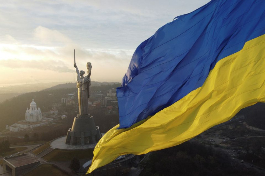 ‘We fear no one’: Ukrainians raise flags to defy Russia invasion fear