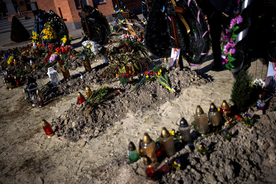 A month into Ukraine’s war with Russia, gravediggers of Lviv mourn the dead
