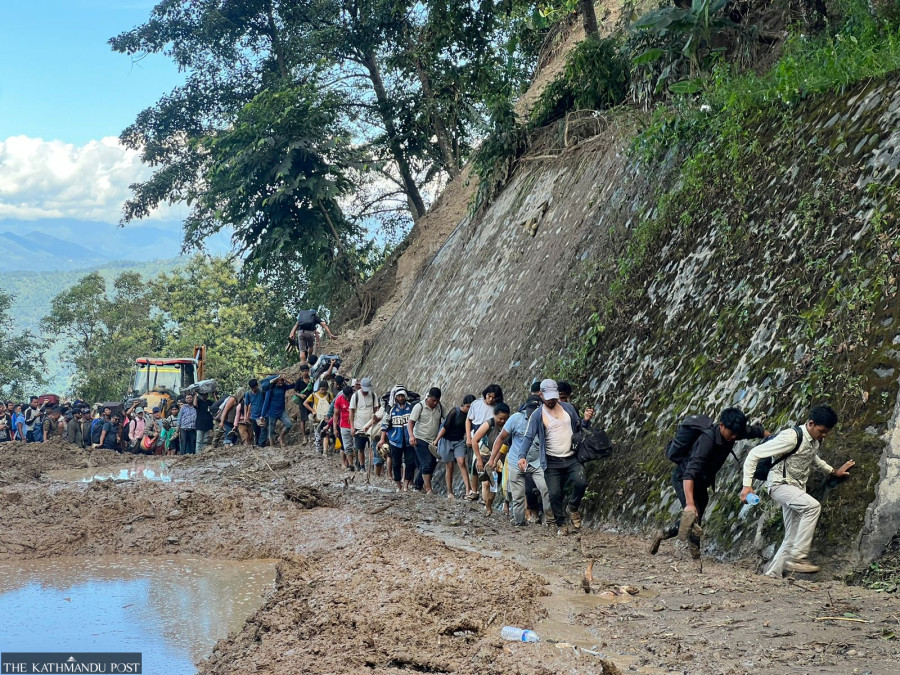 Stranded passengers brave perilous trek on flood-ravaged BP Highway