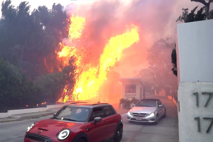 Wildfire rages in Los Angeles, forcing 30,000 to evacuate