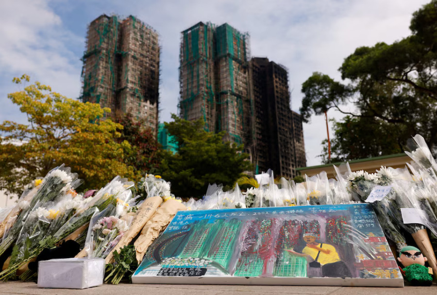 Hong Kong orders judge-led probe into fire that killed 156