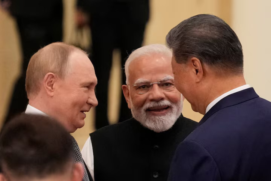 After talks with Xi and Modi, Putin says NATO enlargement has to be addressed for Ukraine peace