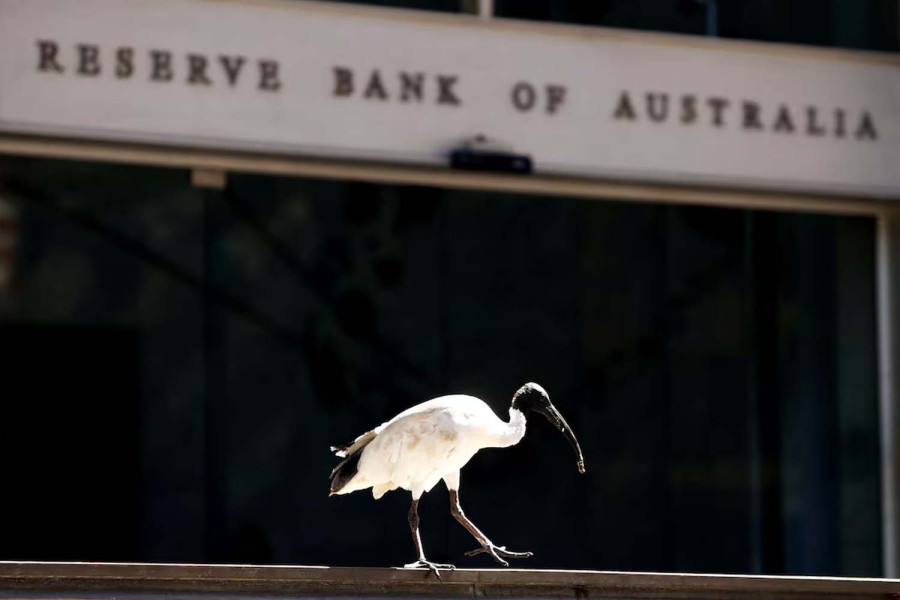 Australia’s central bank cuts rates, cautious on further easing