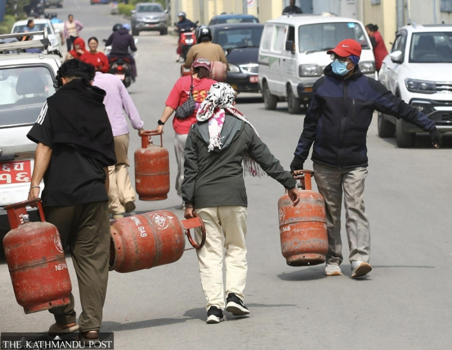 Consumers queue to refill empty cylinders