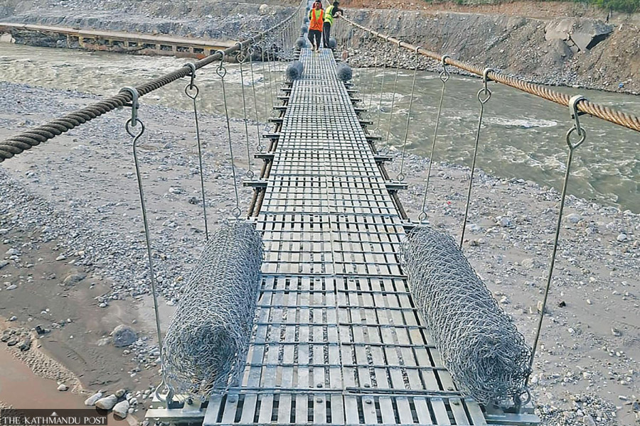 Contractor builds 268-metre suspension bridge in a month after floods cut off communities