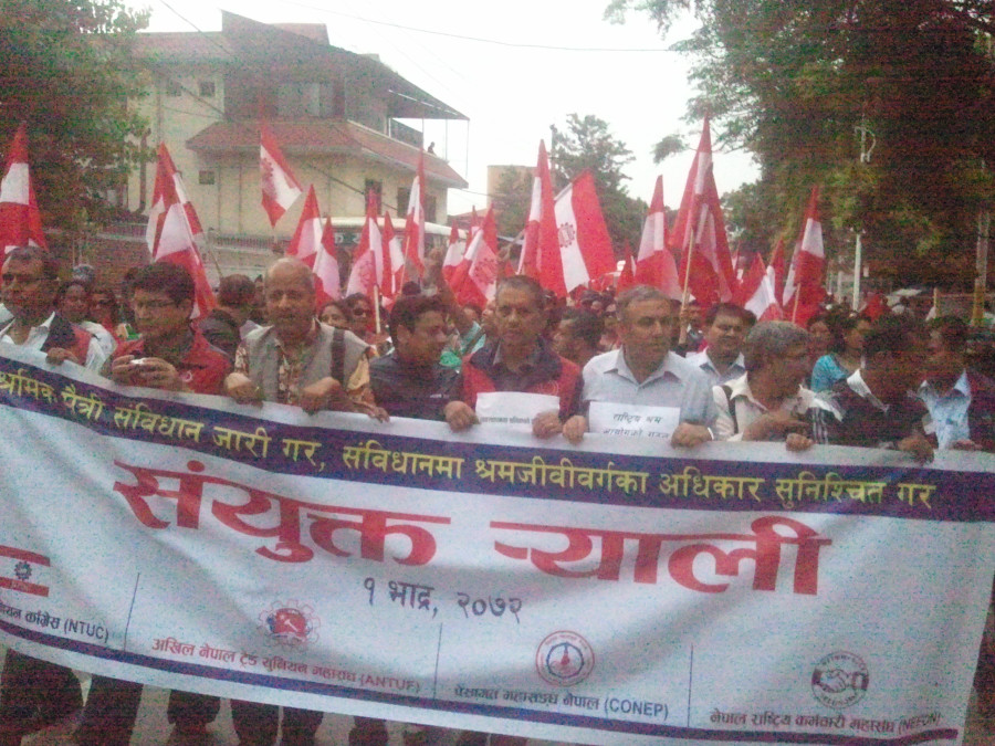 Labour unions march demanding labour-friendly statute