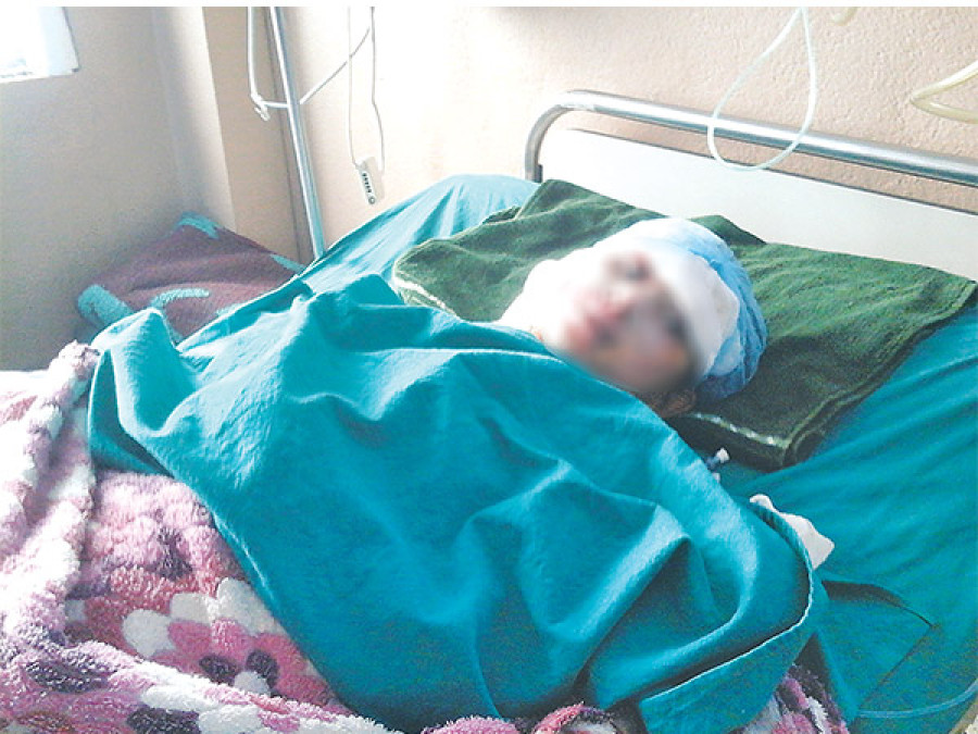 Girls prepare for exam on hospital bed