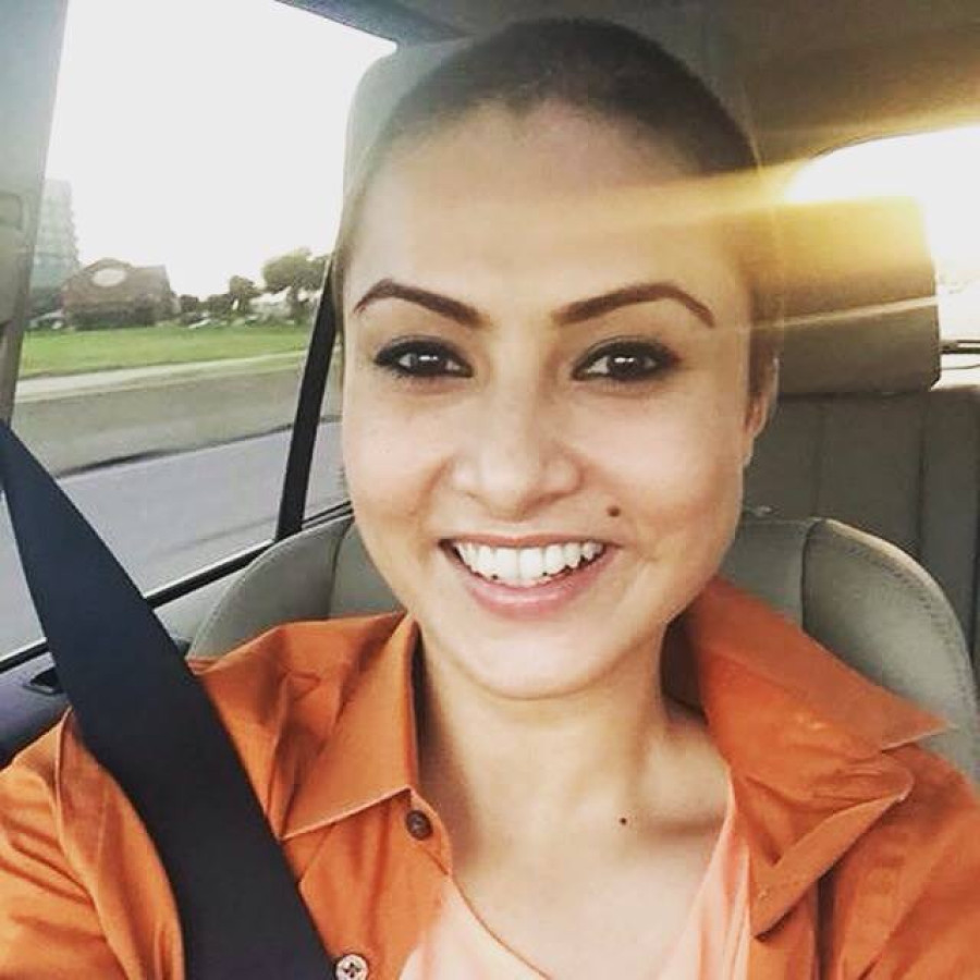 Film actor Nisha Adhikari goes bald