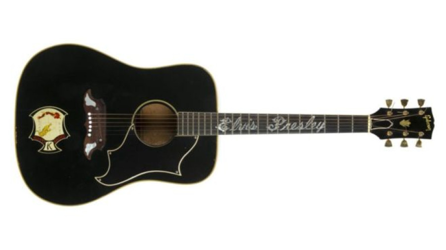 Elvis Presley guitar and John Lennon lyrics auctioned