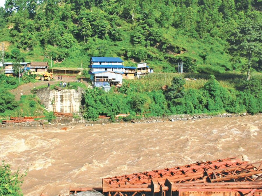 Floods sweep away bridges, damage hydropower project