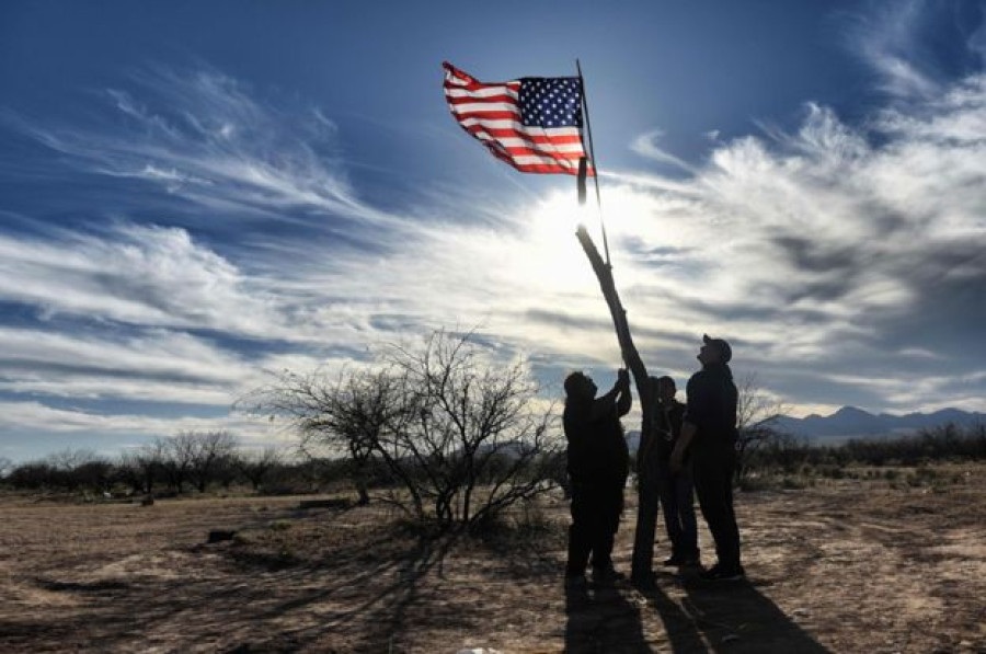 Trump backs down on border wall funding