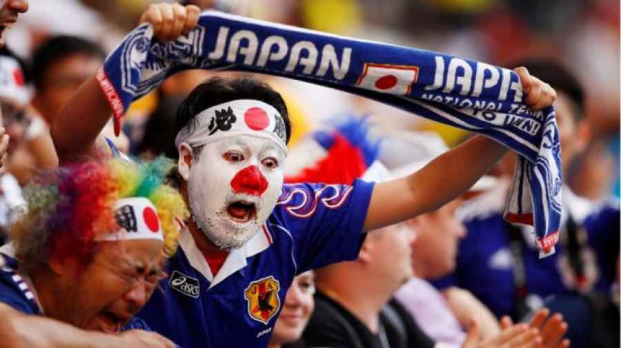 Japan fans clean up stadium after win