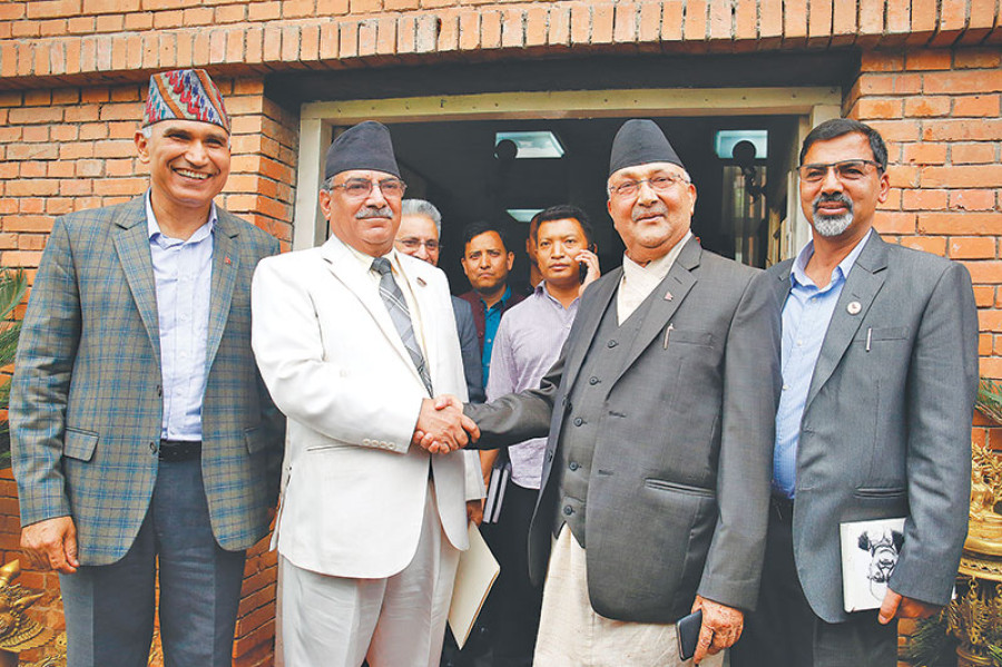 Oli and Dahal shake on Nepal Communist Party