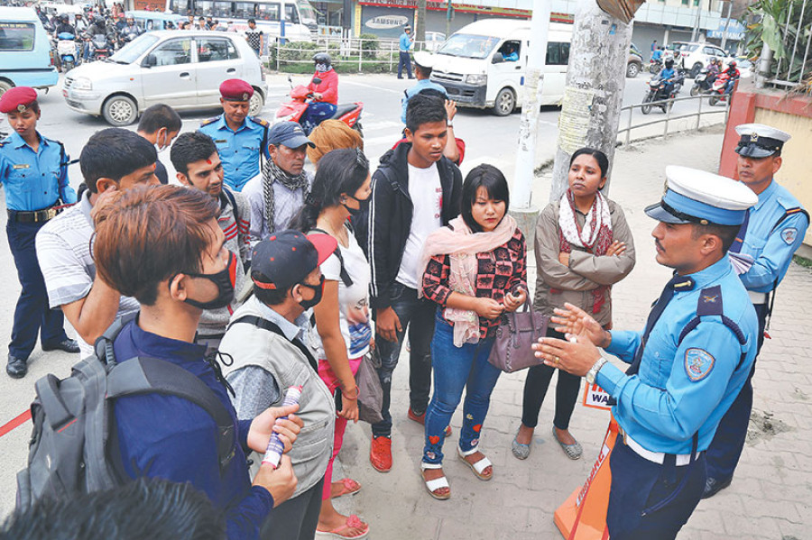Traffic police clamps time-card on heavy vehicles and lane order