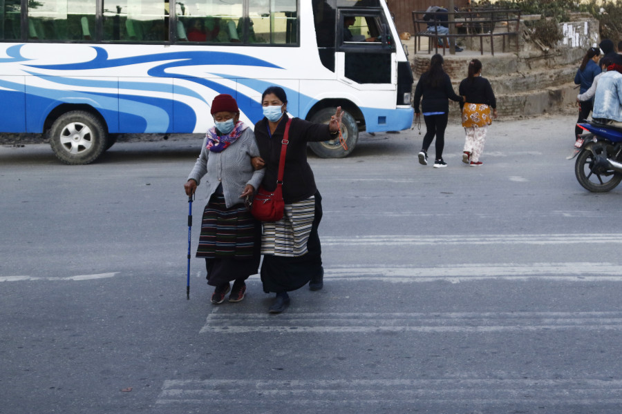 For elderly visitors to Swayambhunath, even crossing the road is a hazard