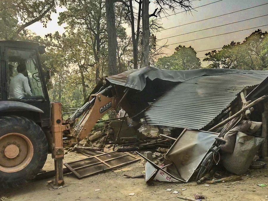 Forest officials demolish illegal structures built on encroached forestland in Kapilvastu