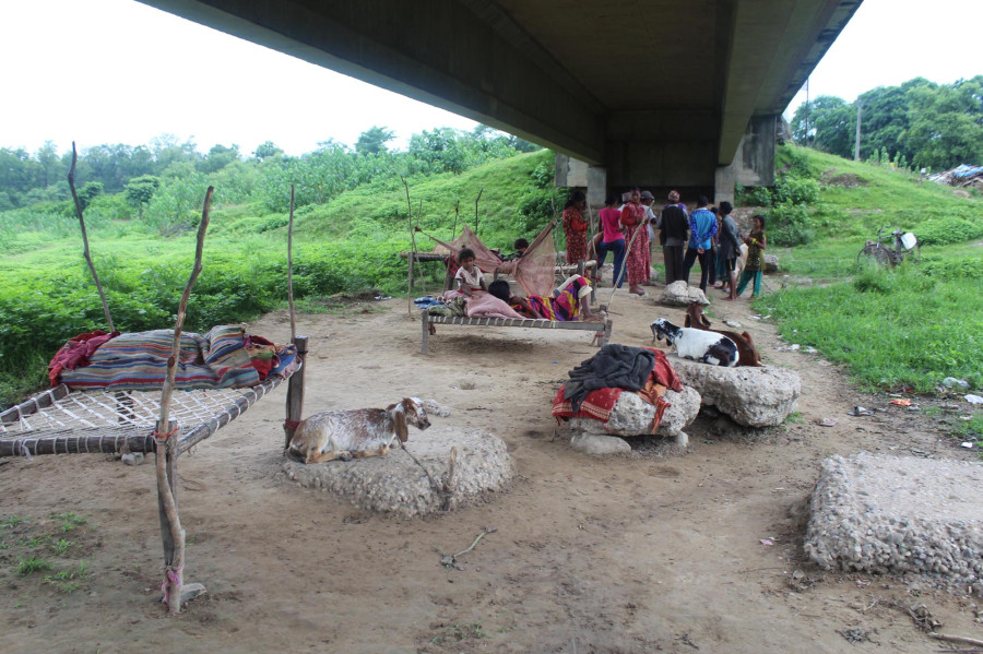 Nineteen squatter families take shelter under bridge after windstorm blew their huts