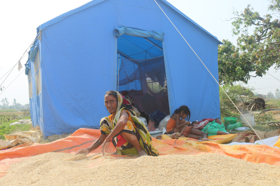 Rainstorm victims living under tents suffer from summer heat