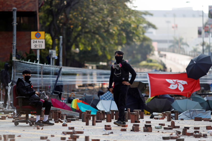 Hong Kong and China condemn attack on justice secretary as protests paralyze city