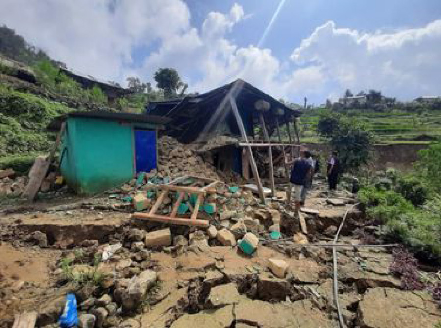 People rendered homeless await resettlement in Musikot