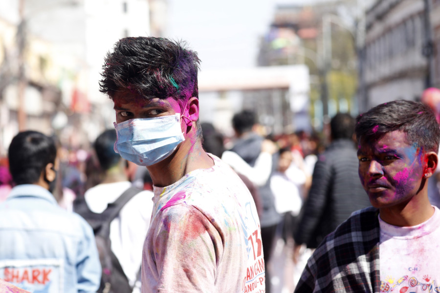 Fears of the coronavirus force most of Kathmandu indoors on Holi