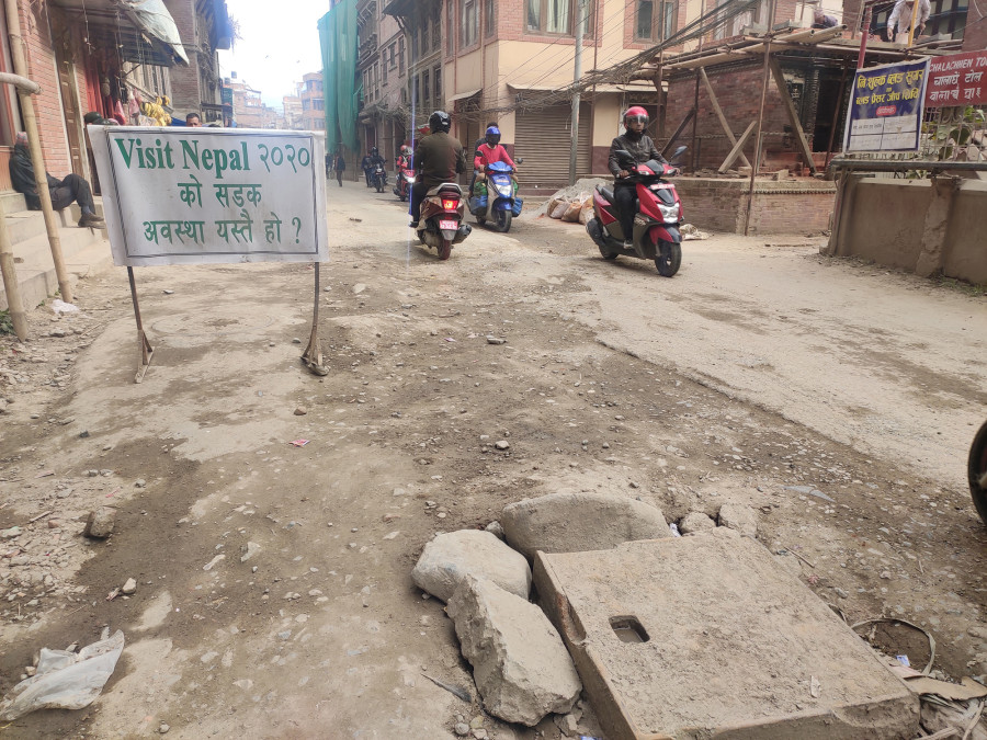 Lalitpur locals call officials out on dusty, pothole-riddled road