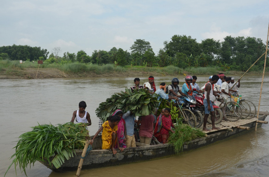 Locals still cross Lalbakaiya river in Tikuliya Ghat by boat