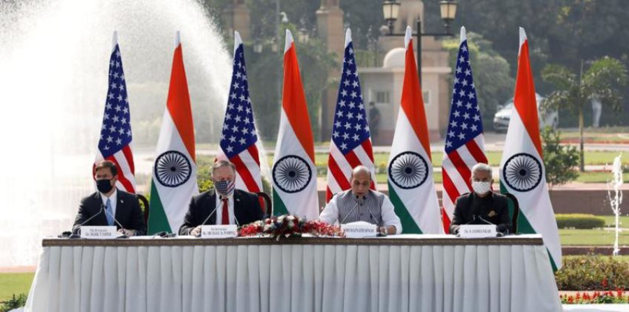 U.S. warns of threat posed by China, signs military pact with India