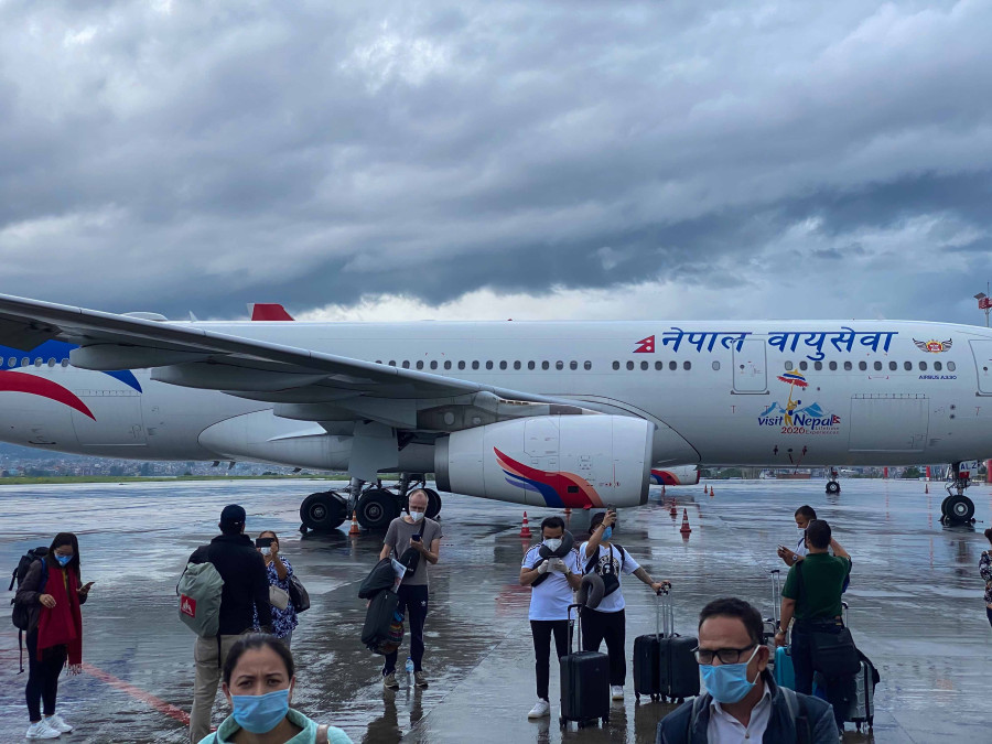 Tourists wait to get out amid virus surge, lockdown