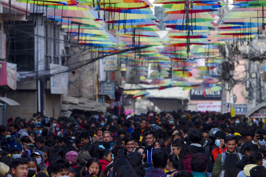 Not able to cope with the crowds, colourful umbrellas are taken off at New Road