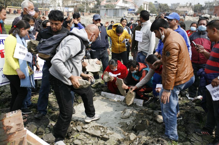 Heritage conservationists smash concrete structure built at Kamal Pokhari