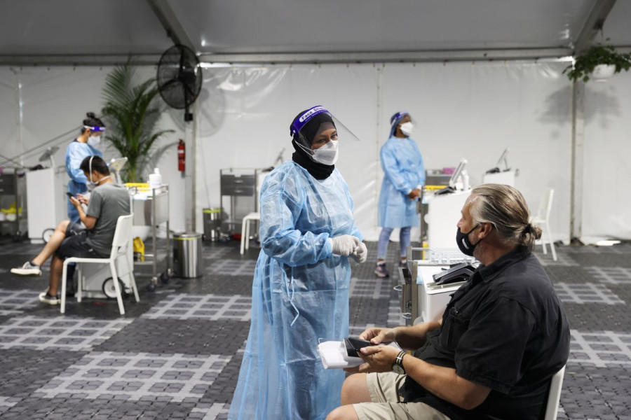 WHO flags global risk from Omicron, countries tighten curbs
