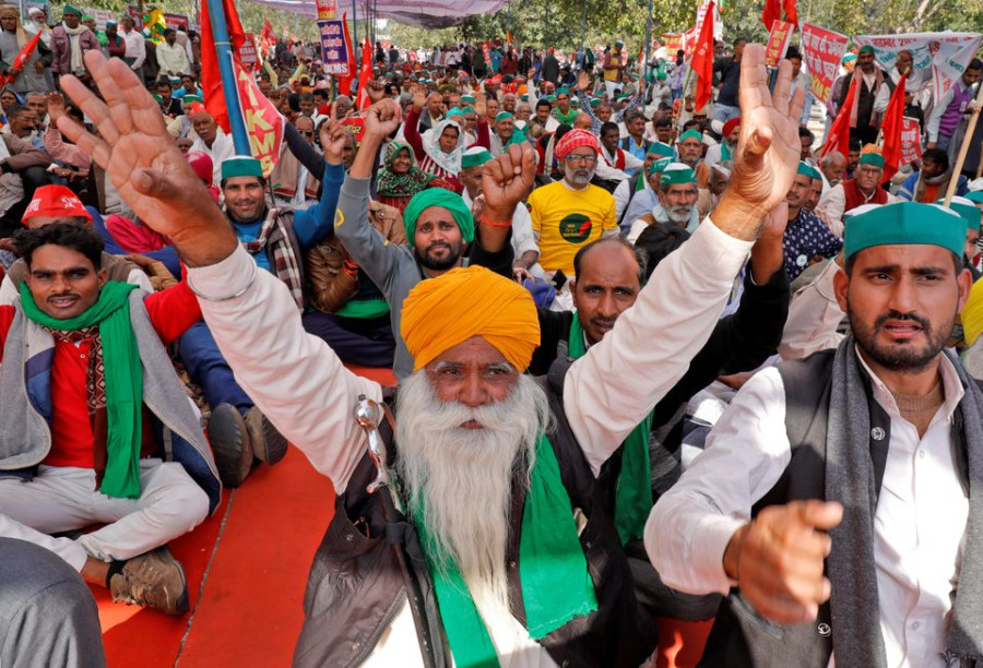 Indian farmers hold mass rally, keep pressure on Modi despite climbdown