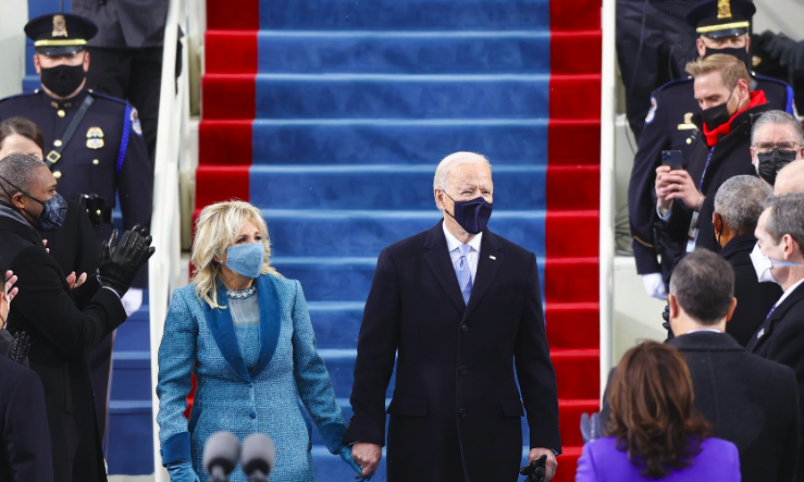 Assuming U.S. presidency, Biden tells divided nation 'democracy has prevailed'