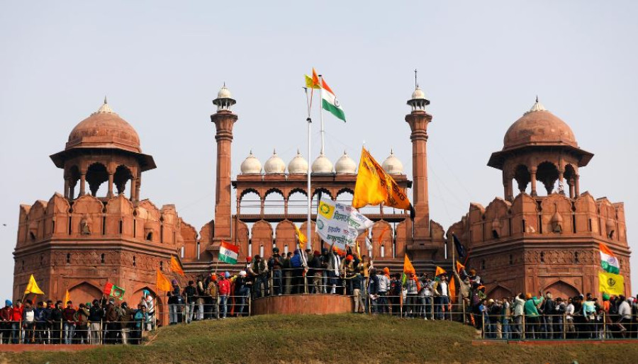 Indian farm protesters battle police to plant flags at historic Red Fort