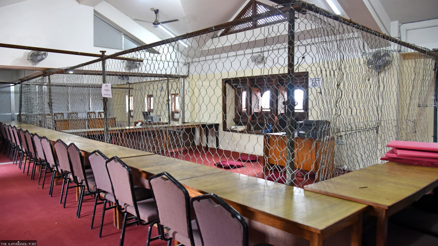 Counting votes within wire fences reflects degrading political culture