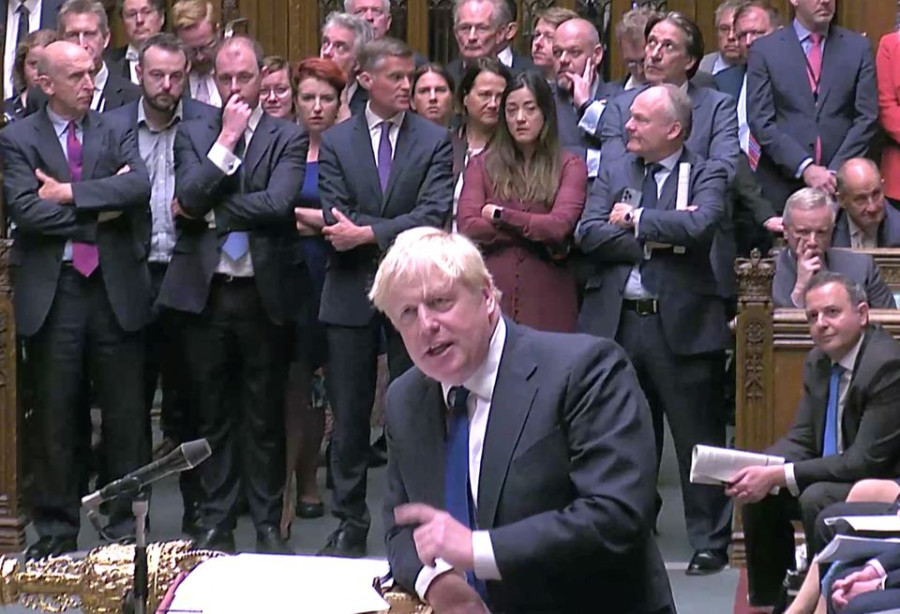 Increasingly isolated, Boris Johnson pledges to fight on