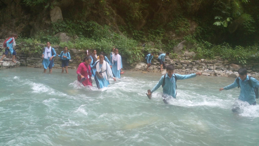 Students from remote Baitadi village brave river to reach school every day
