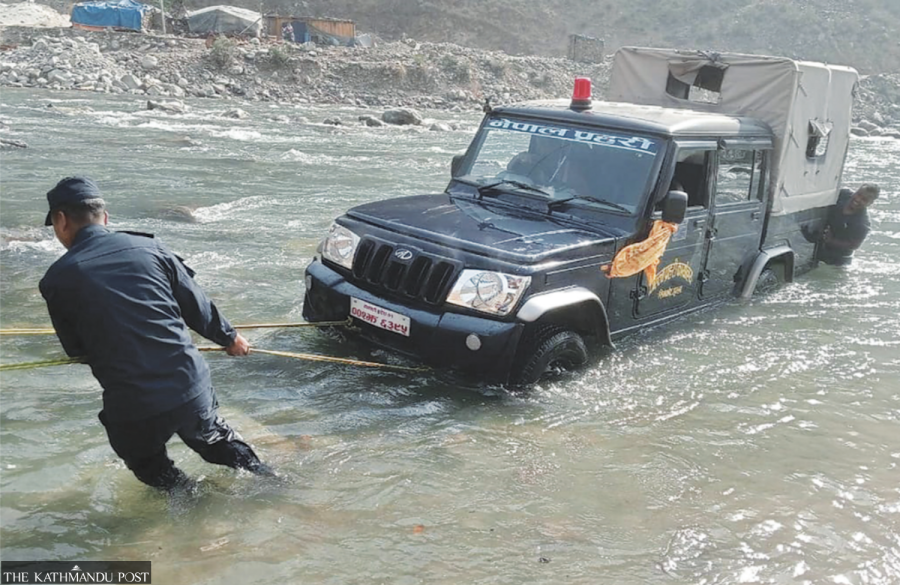 People in northwestern edge of Nepal wait for vital bridge