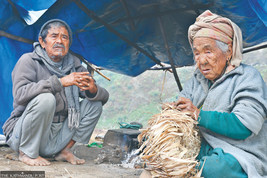 Quake-displaced people battle inclement weather